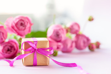 Concept Mother's Day, Valentine's Day. Gift present box with beautiful pink flowers roses bouquet.