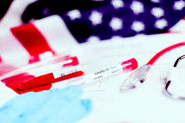 Stethoscope and test tubes on report of covid19 infected in the world.