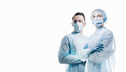doctors man and woman on a white background in medical masks on the face - 336110478