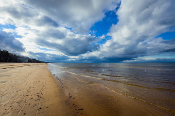 Sandy Jurmala Coastline under Cloudy Blue Sky, Latvia