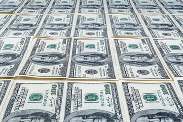 One hundred dollars. US dollars background. Many banknote hundred-dollar bills. American currency.