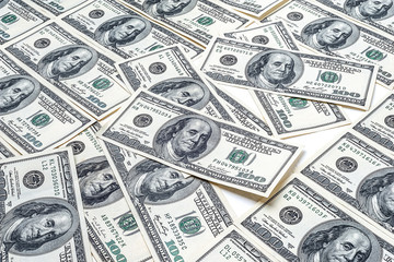 Many one hundred dollars. US dollars banknotes background. Hundred dollar bills. American currency.