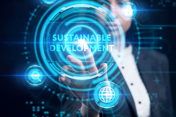 Business, Technology, Internet and network concept. Young businessman working on a virtual screen of the future and sees the inscription: Sustainable development