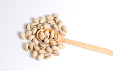 Pistachios in a wooden spoon. Top view