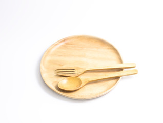 wooden plate top view on white background. With a repair spoon placed on the plate