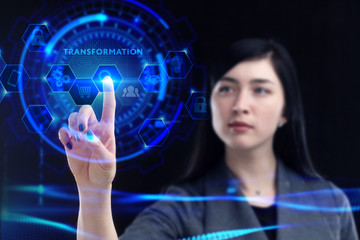 Business, Technology, Internet and network concept. Young businessman working on a virtual screen of the future and sees the inscription: Transformation