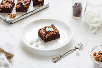 Chocolate brownie cake with marshmallows and nuts