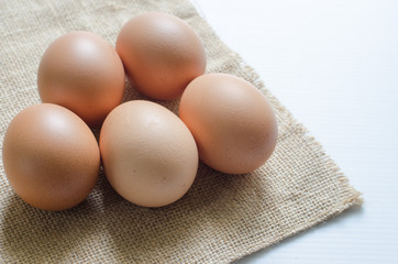 .Raw chicken eggs, high protein, organic, healthy with sackcloth on the floor