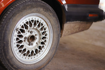 The mechanic is checking the engine.