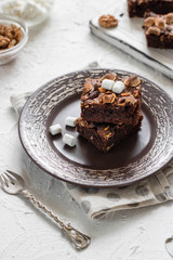 Chocolate brownie cake with marshmallows and nuts