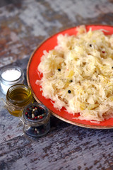 Plate with sauerkraut. Fermented foods. Probiotics Homemade fermentation of cabbage.