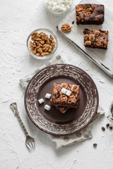 Chocolate brownie cake with marshmallows and nuts