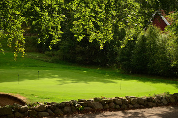 Grassy lawn prepared for golf in rainy day