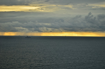 Golden sunset with rains all over the horizon