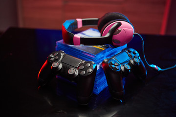 Game controller, videogame joystick or gamepad on a table. Close up studio shot