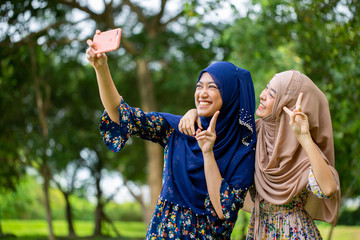 Two Asian muslim woman selfie