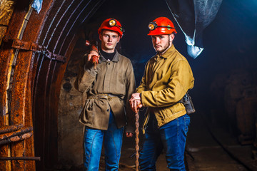 Two miners in the mine