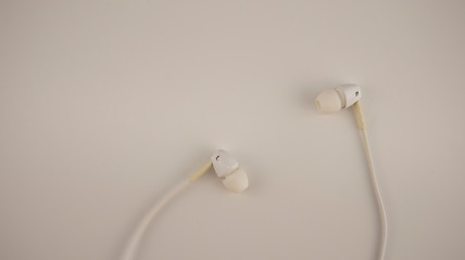 white headphones lie on a white background