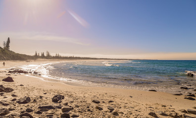 Fototapeta na wymiar Almost deserted beach on a bright sunny day in Australia
