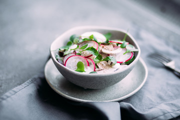Salad with fresh mushrooms, radish and arugula. Vegetarian food. Lean salad