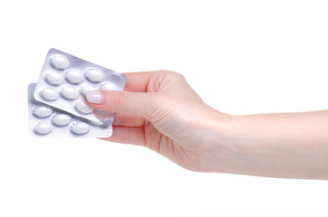 blister white pills capsules in hand medicine pharmacy on white background isolation