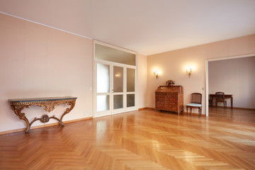 Large room with antiquities in apartment interior