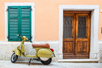 Scooter leaning against a wall in Rovinj, Croatia