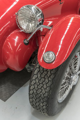 vintage fender and light of red car, Wanaka, New Zealand