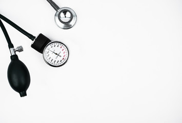 Top view of two different essential part of a blood pressure measuring machine on a white background