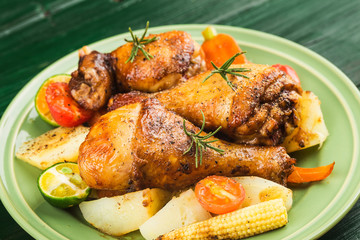 Grilled chicken leg with boiled potatoes and vegetable