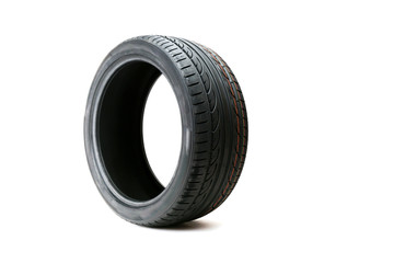car tire with directional rotation isolated on a white background. new modern low profile car tyre