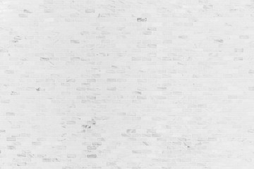 Abstract background from old white brick pattern on wall.