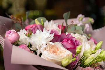 Bouquet of pink roses and white gerberas.