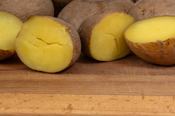Naklejka na ściany i meble boiled potato on wooden background