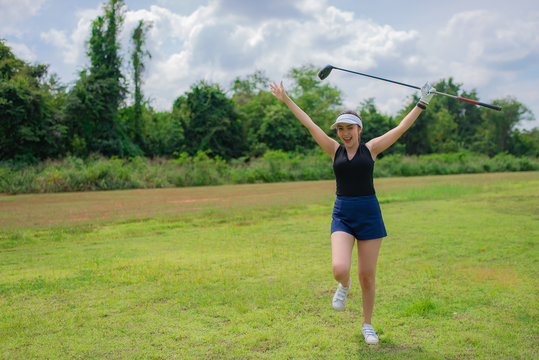 Portrait Of Golfer Asian Woman Holding Golf Wood At The Country Club,Happy Woman Concept