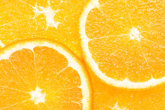 Macro close up photo of sliced orange  from above. Slice of juicy orange.