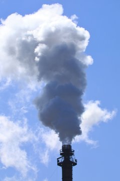 Smoke emitting from factory smoke stacks