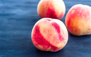 fresh peaches on a wooden background