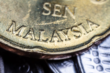 macro photography of 50 Malaysian ringgit cent. The bank negara fifty cent coin of Malaysia. Sharp detailed capture of the Malaysia character on the RM 50 sen coin. microscopic picture of this coin