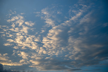 Obraz premium Blue sky with cloud on sunset with orange sun light