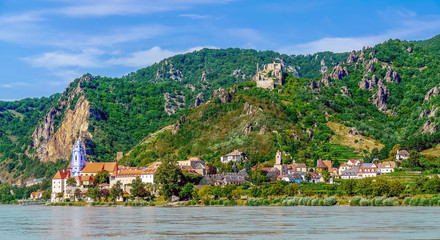 Durnstein, Wachau, Austria - August, 2011: Skyline of the town on the banks of the Danube with the...