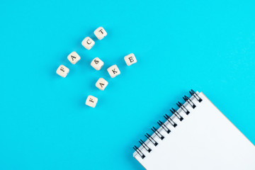 Fake or fact cubes with letters on a blue background