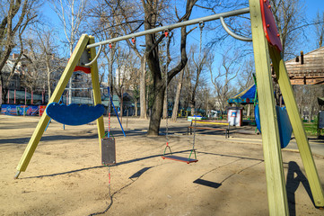 Empty children playground in cathedral square park in the center of Chisinau, Moldova during state...