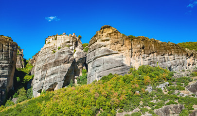 Fototapeta na wymiar Meteora monastery on Corfu mountains with greenery.