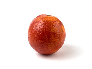 Fresh blood orange with soft shadow isolated on a white background side view