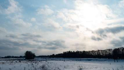 Landscape of snow covered countryside with beautiful sky