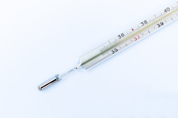 Thermometer on a white background, healthcare coronavirus, cancer, painand treatment, pharmaceutical medicine concept .