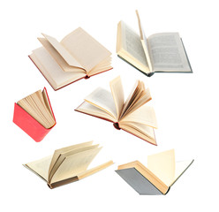 Old hardcover books flying on white background