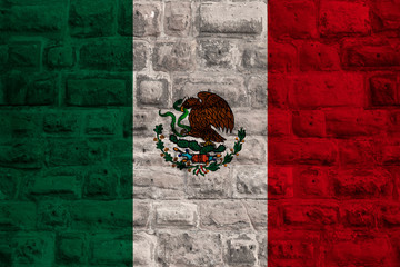 national flag of the modern state of mexico on an old historical stone wall, concept of business, tourism, travel, emigration, globalization