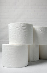 White rolls of toilet paper with white background